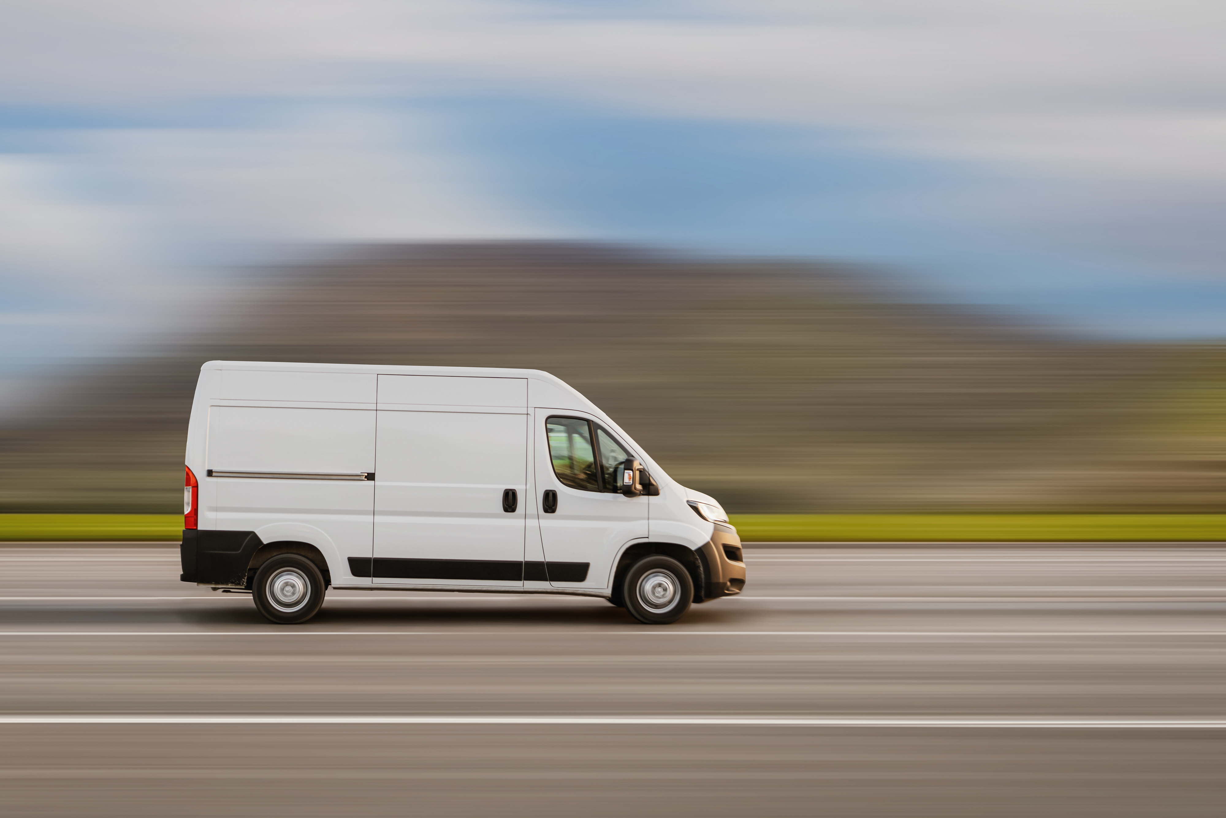 Fleet maintenance and repair in Groveland, FL with Griffis Automotive Clinic. Image of white fleet van on the road for deliveries.