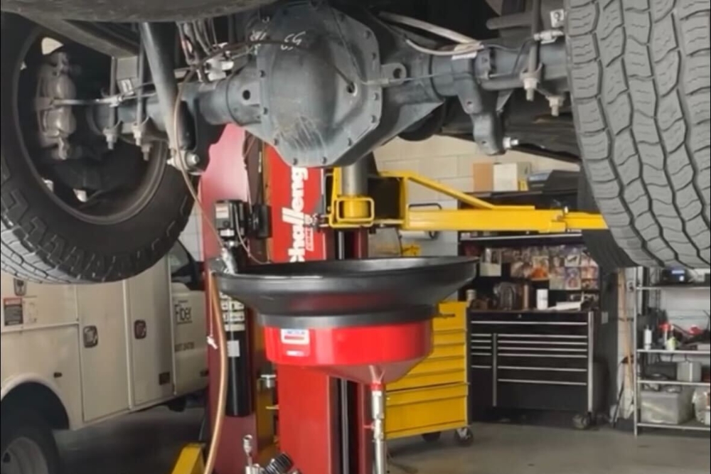 Differential Flush in Groveland FL at Griffis Automotive Clinic. Close-up of a differential being flushed during vehicle maintenance