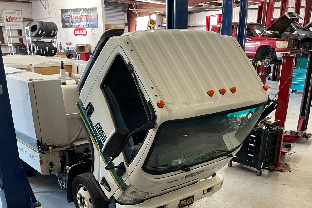 Fleet Maintenance in Groveland FL At Griffis Automotive Clinic. Image of commercial truck vehicles in auto repair for fleet maintenance