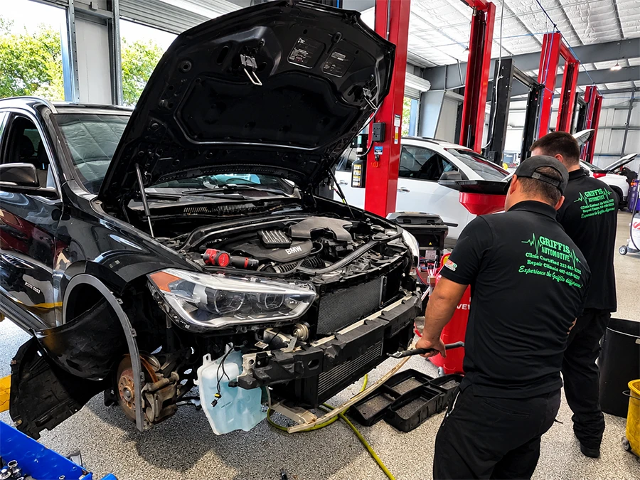 Griffis Automotive technician servicing a vehicle in the repair shop